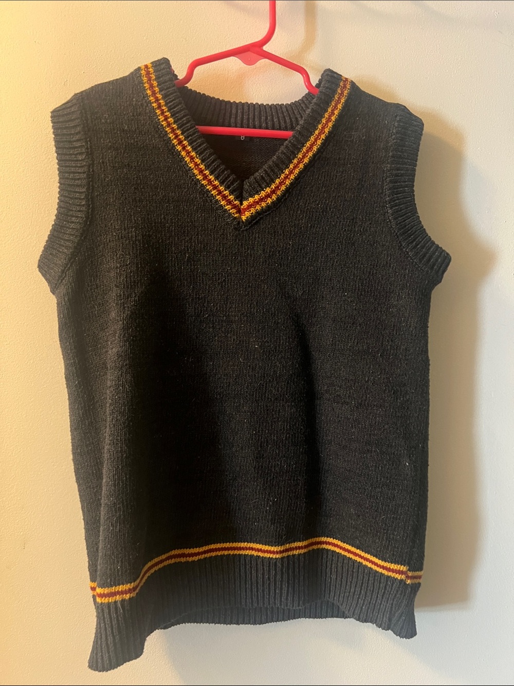 Harry Potter Kids Black V-Neck Sweater Vest with Gold and Red Stripe